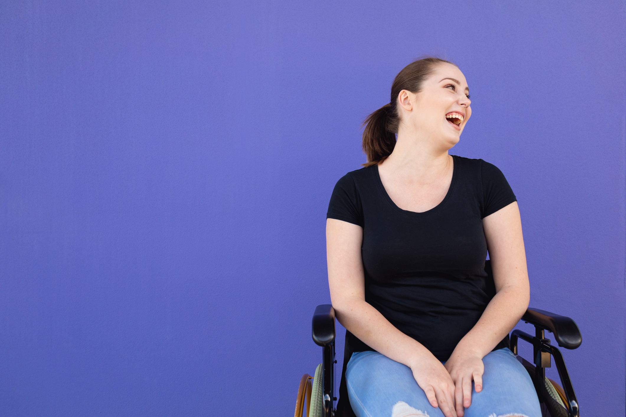 Confident Young Disabled Woman In Wheelchair