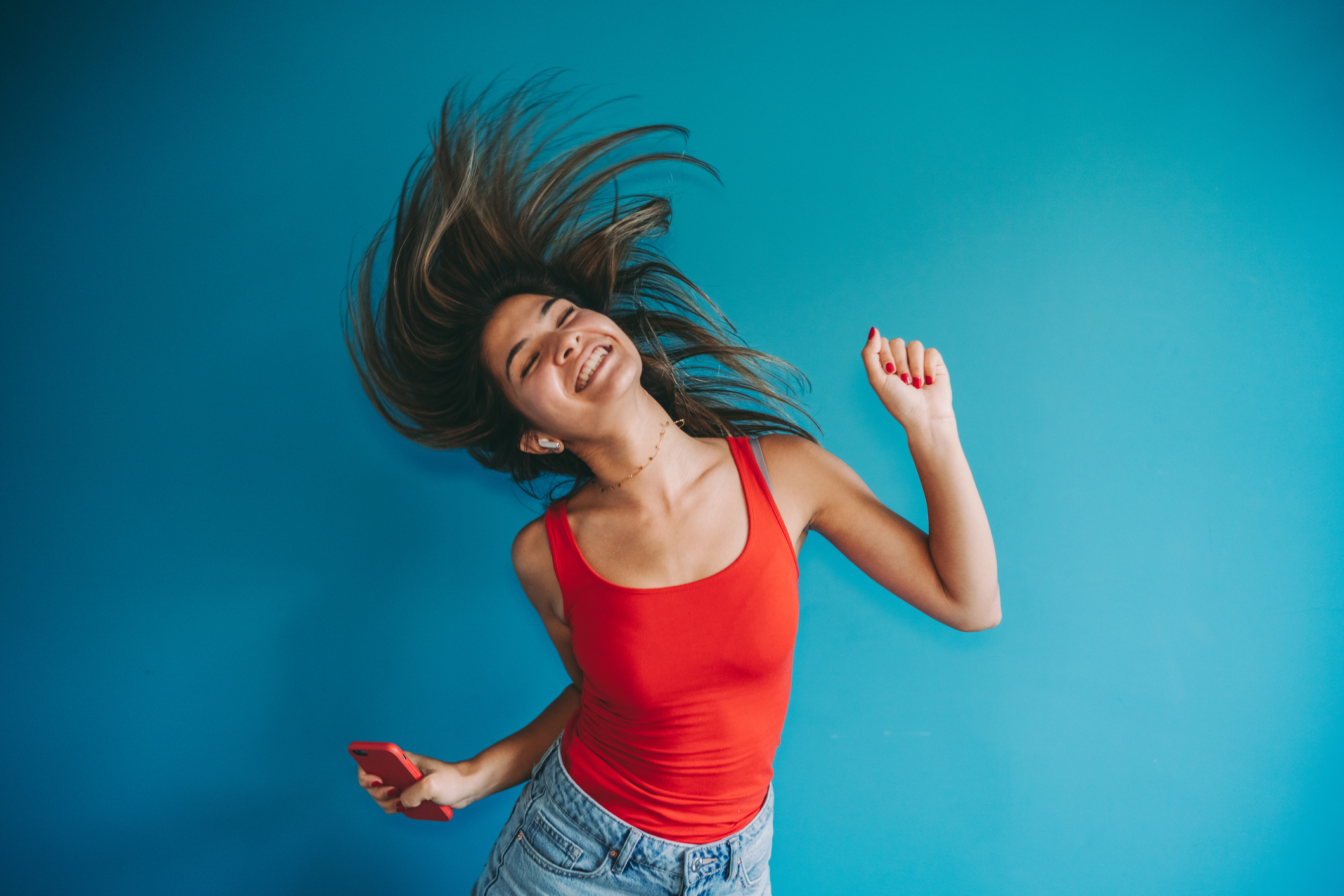 Young woman dancing to music