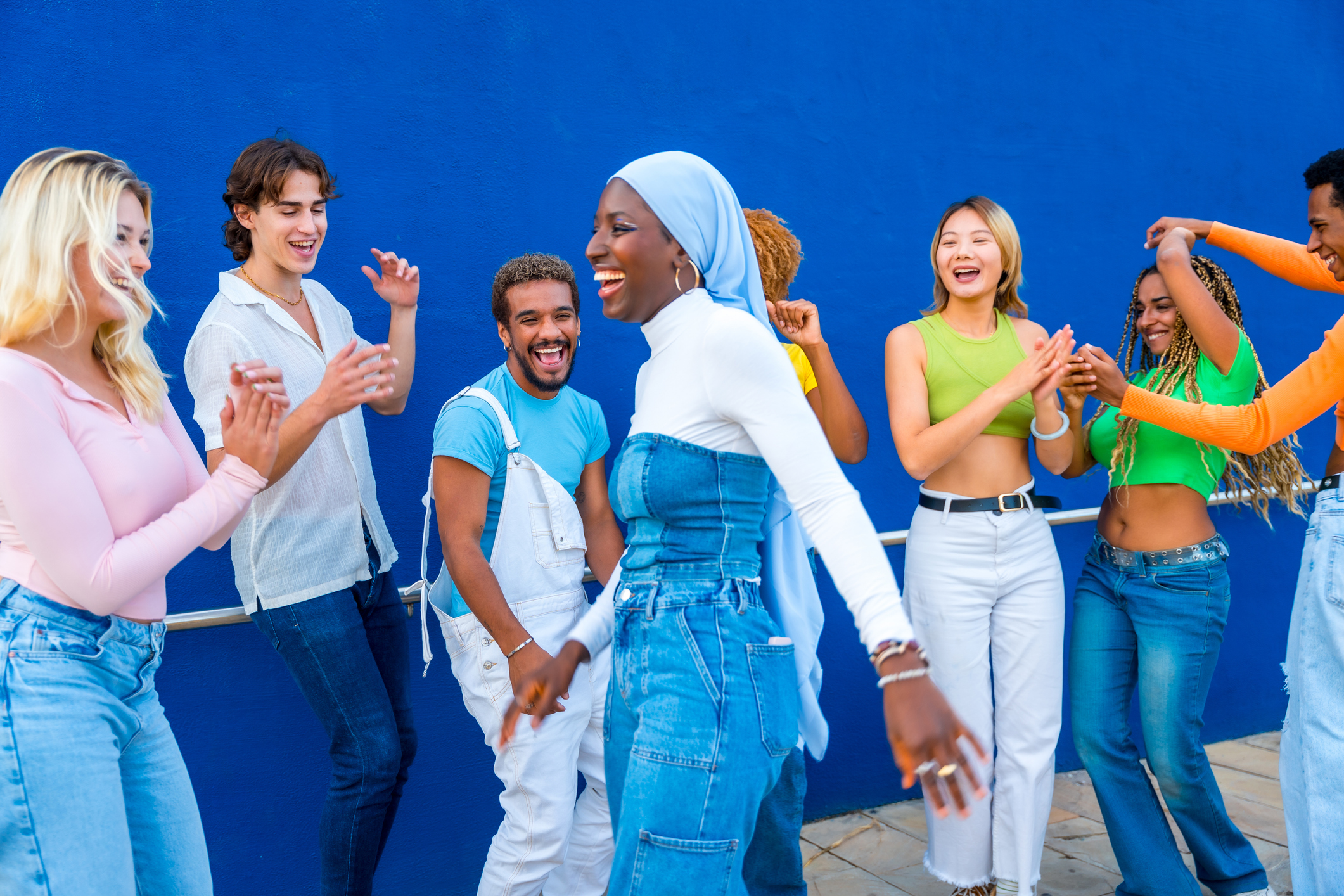 Muslim young woman dancing in a dance battle with friends